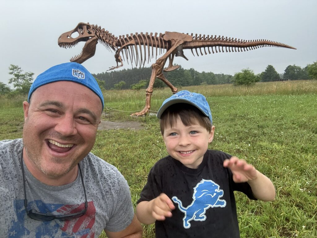 David Keyte and his son Benson with a dinosaur display